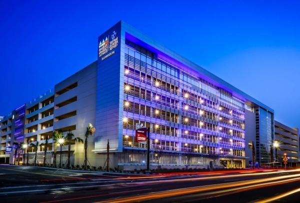 Exterior photo of Baptist parking structure at night.